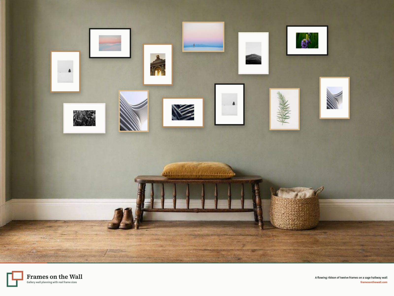 A flowing gallery wall of twelve small frames above an antique bench on a sage green hallway wall
