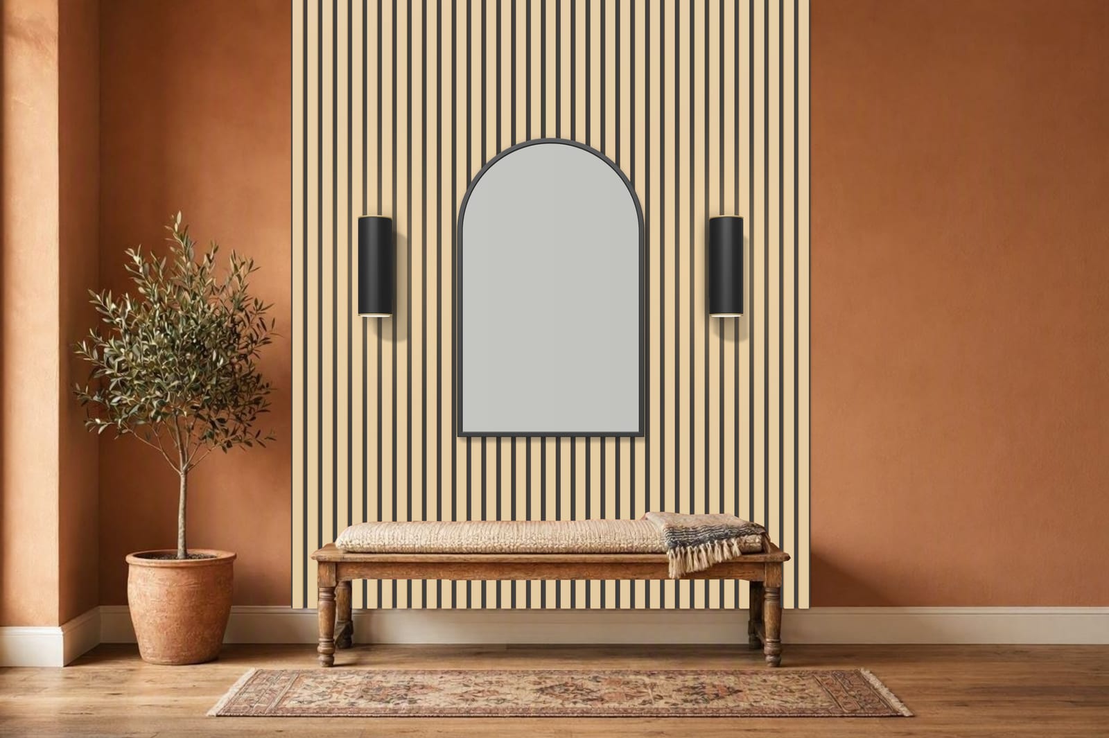 Oak slatted wall from floor to ceiling behind a wooden bench, with a black arched mirror and two wall sconces in a terracotta entrance